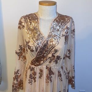 Dress size small, shiny! Color peach fabric, rose gold sequins.